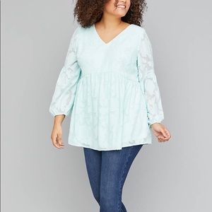 A woven babydoll blouse